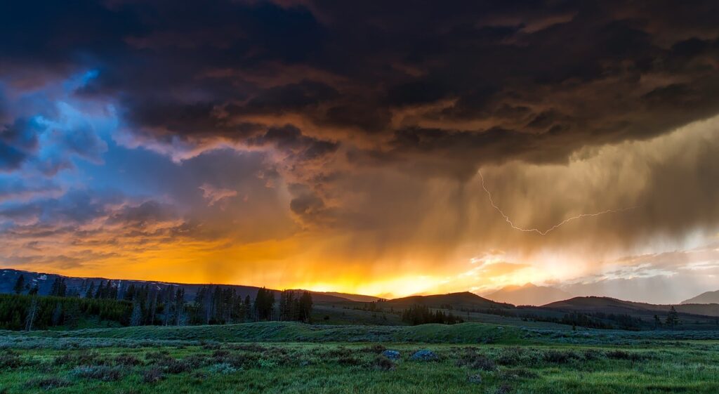 Dark clouds against lightning and light