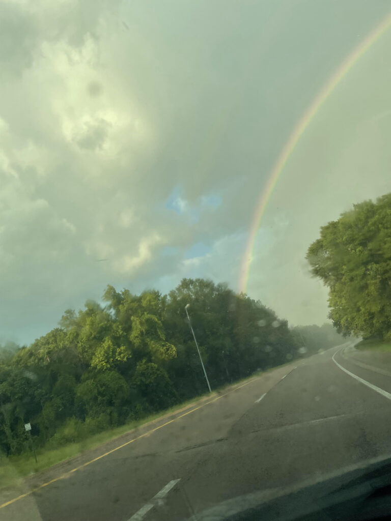 Rainbow in clouds and light rain on feast day of Our Lady of Mt. Carmel